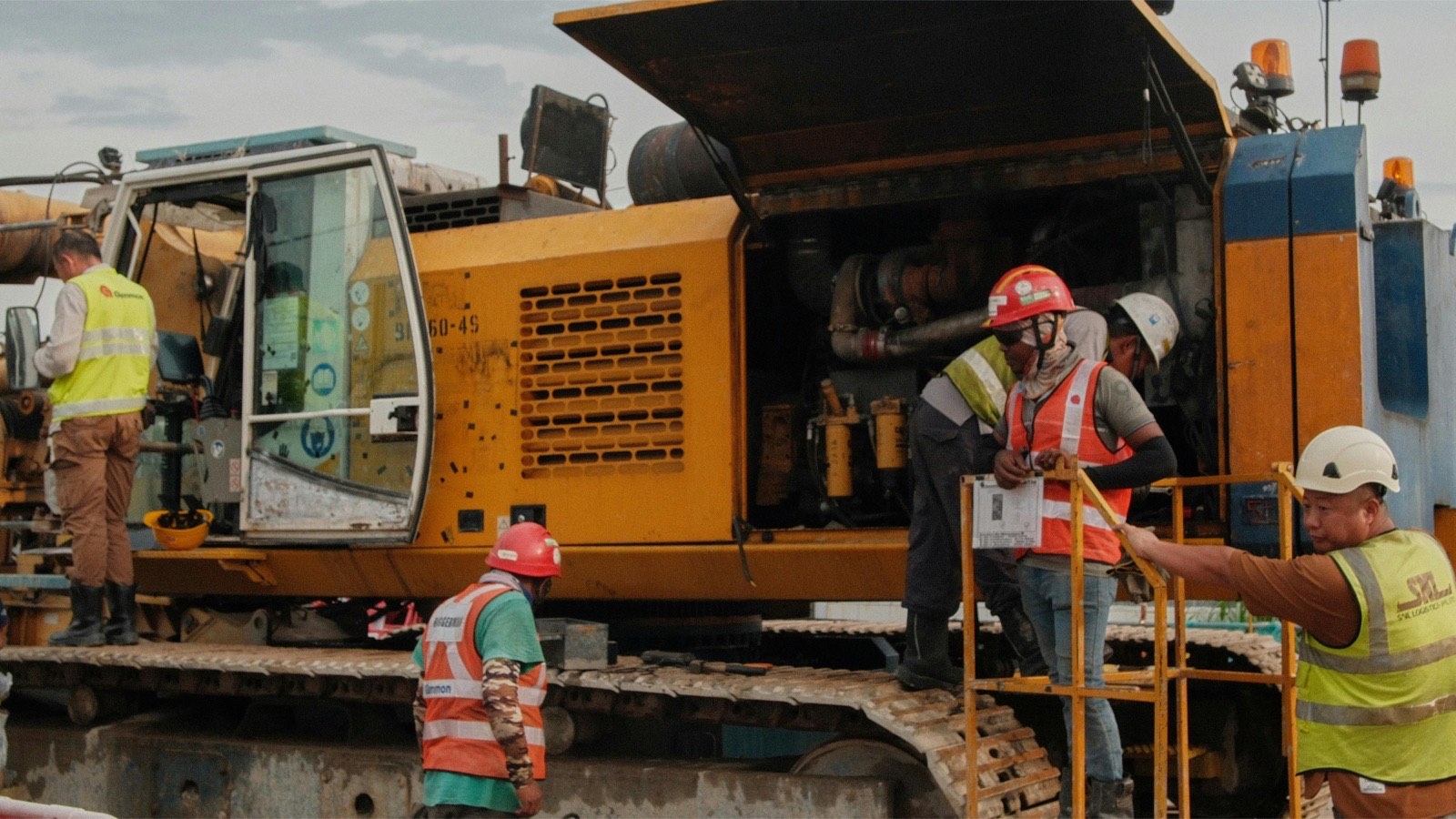 Paving equipment with a crew on site